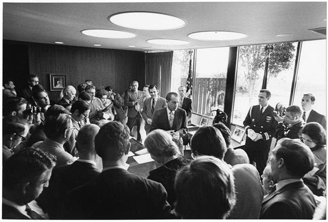 President Nixon speaks with the press in his Western White House office